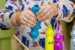 human-person-squeezing-bottle-on-a-container-finger-finger-image (1).jpg